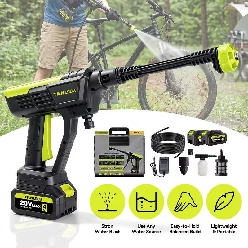 Person using a portable cordless pressure washer to clean mud off a mountain bike outdoors